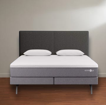 best mattress - sleep number p6 a sleep number p6 mattress on bed base, on wood floor against a white wall