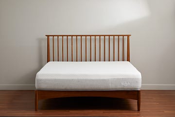 a white and gray nolah mattress on a wooden bed frame