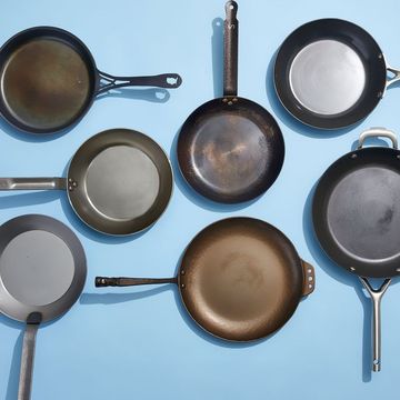 a collection of carbon steel skillets