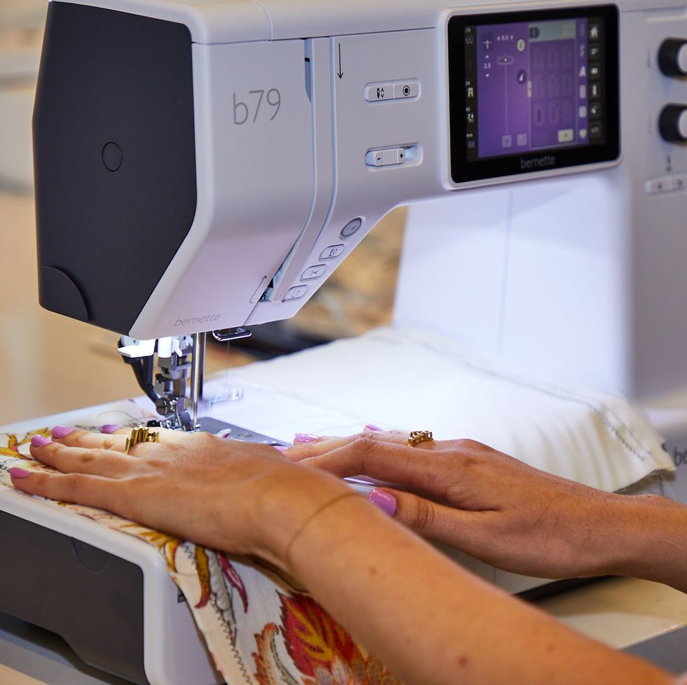 gh analyst is sewing on floral fabric to asses how well the machine performs as part of good housekeeping's testing for sewing machines for beginners