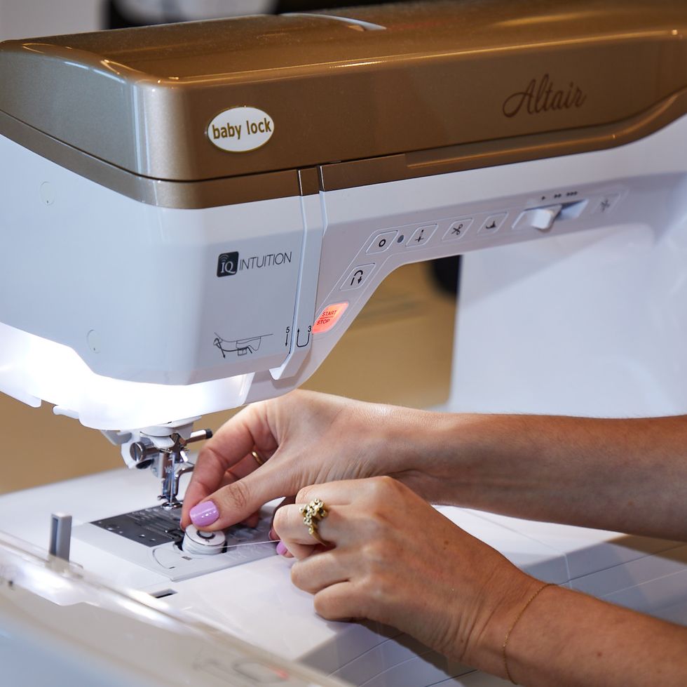 gh analyst is putting in bobbin thread to test the best embroidery machines
