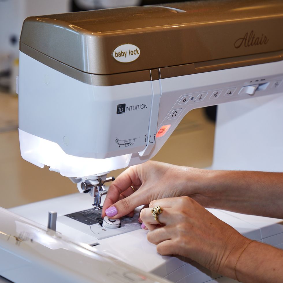 gh analyst is putting in bobbin thread to test the best embroidery machines