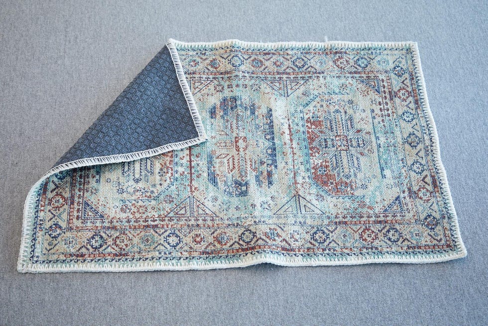 a folded colorful rug from adiva