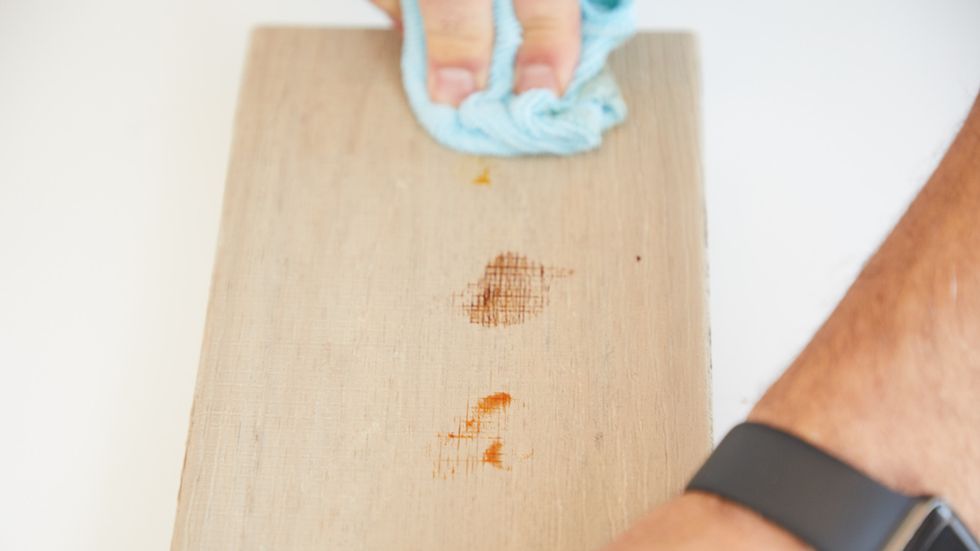 an expert measures stain resistance of a deck board