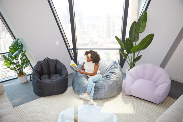 Comfortable modern lounge area with bean bag chairs and a plant