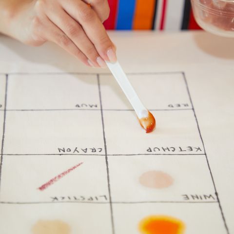good housekeeping institute cleaning lab analyst applying food stains to fabric swatches