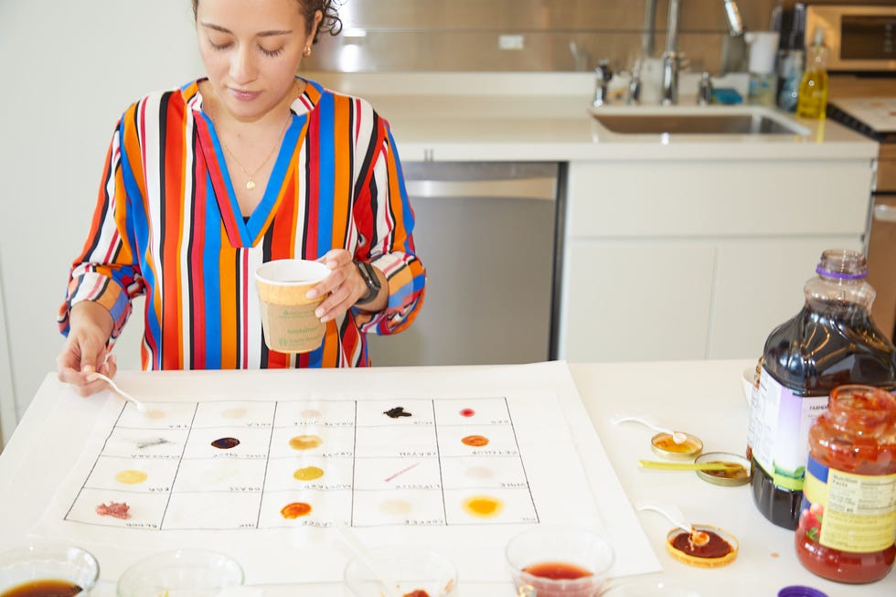 good housekeeping cleaning expert applying stains for stain remover testing