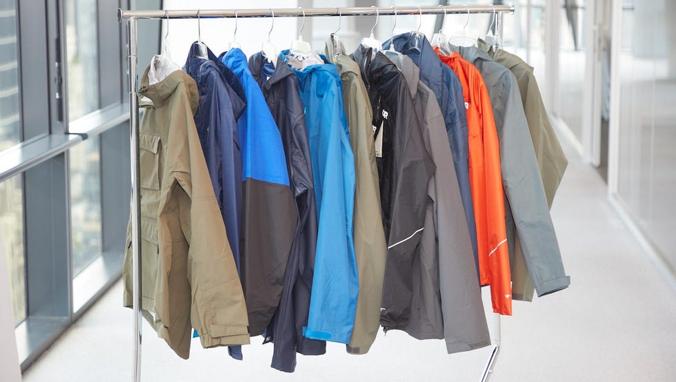 best rain jackets for men a rack of men's rain jackets in a hallway