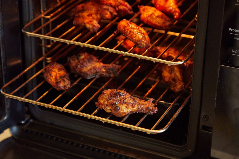 cooked chicken wings in an oven