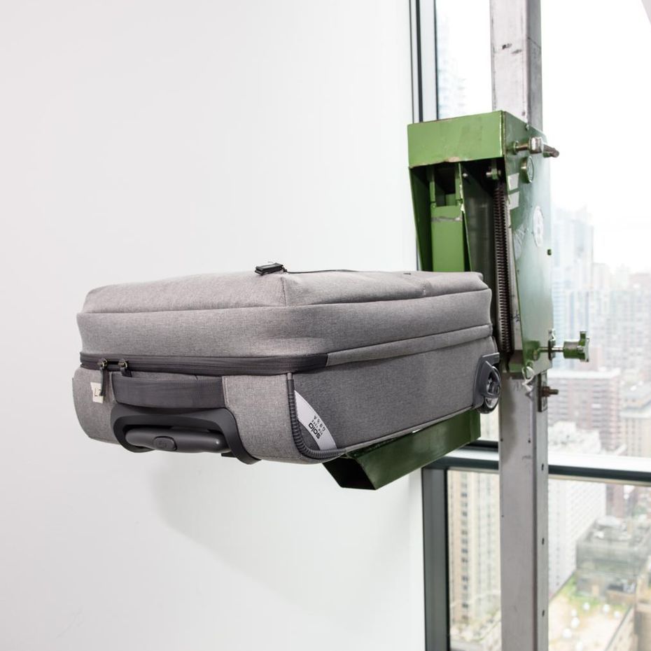 a piece of grey luggage sitting on the drop tester