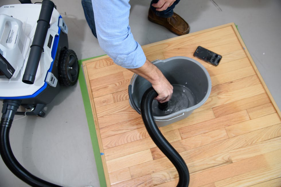 a good housekeeping institute experts sucks up water as part of the shop vac test