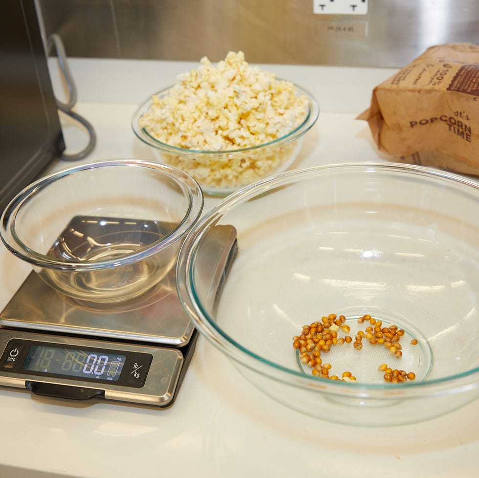 microwave testing popcorn kernels being weighed during microwave testing
