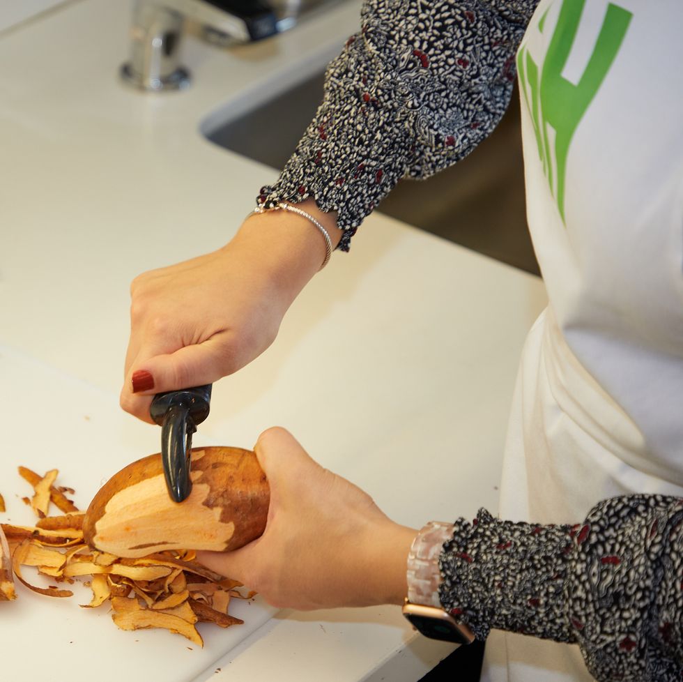 peeling potatoes at the good housekeeping institute meal delivery testing