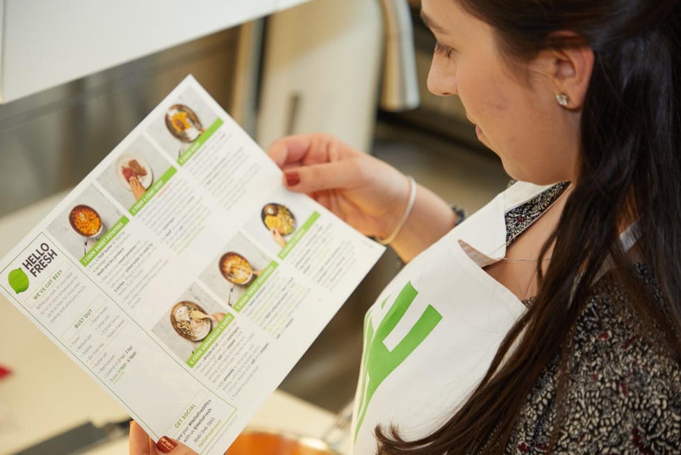 sassos reviewing the recipe for a meal delivery service kit