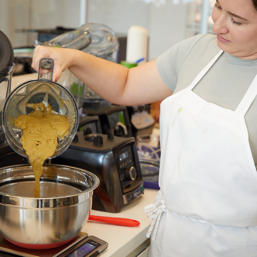 Blender testing straining smoothie into sieve