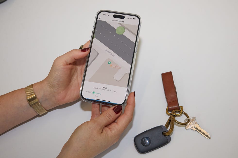 a hand holding a smart phone