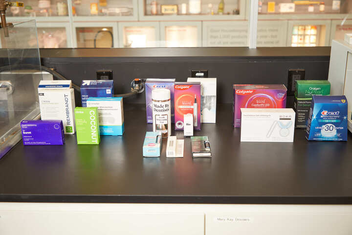 various pharmaceutical and dental care products displayed on a counter