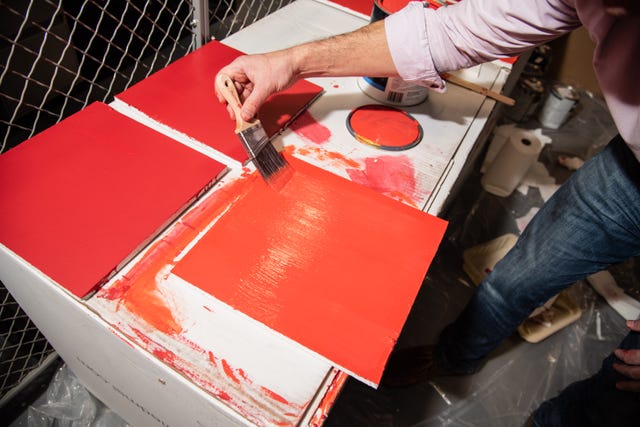 an experts paints test panels as part of interior paint test at the good housekeeping institute