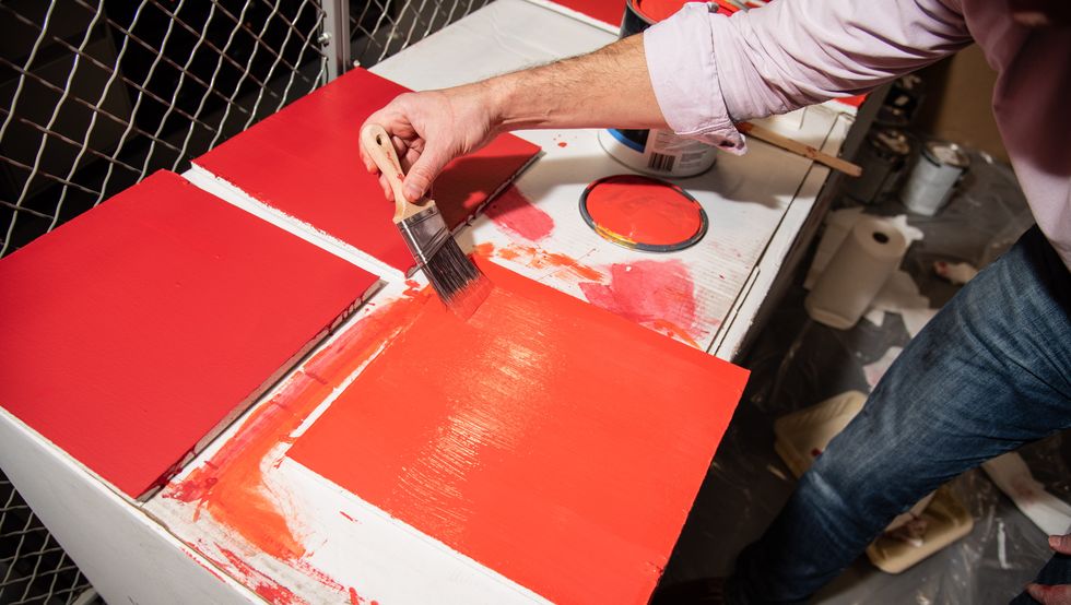 an experts paints test panels as part of interior paint test at the good housekeeping institute