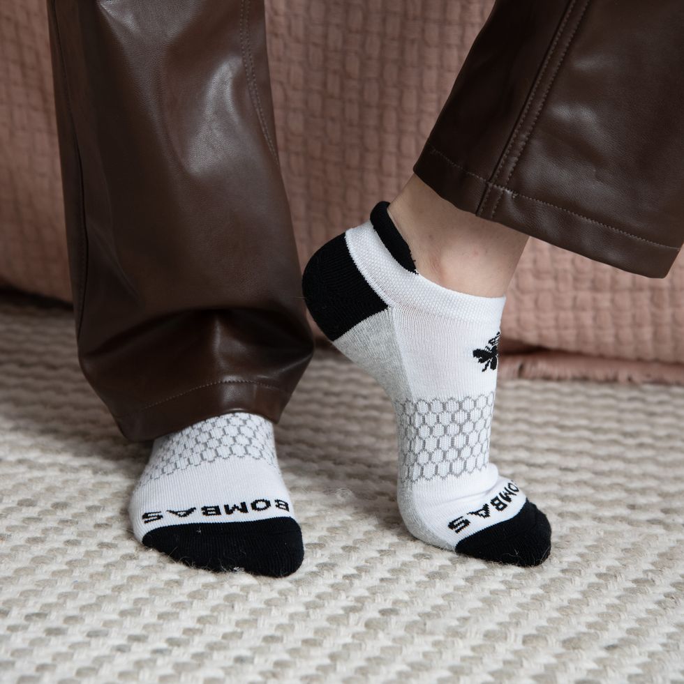 a model wearing black, white and gray bombas ankle socks