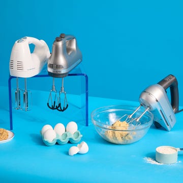 best hand mixers three hand mixers surrounded by eggs, flour and cookies