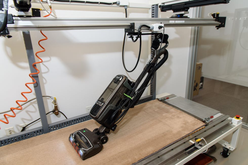 a shark upright vacuum on a testing machine