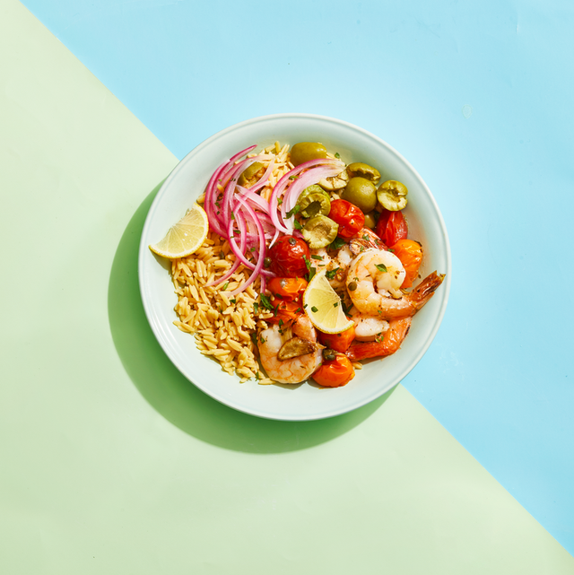 seafood dish featuring shrimp tomatoes olives and orzo pasta