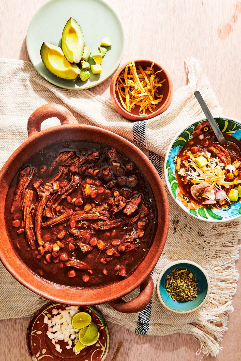 pozole rojo in a clay pot