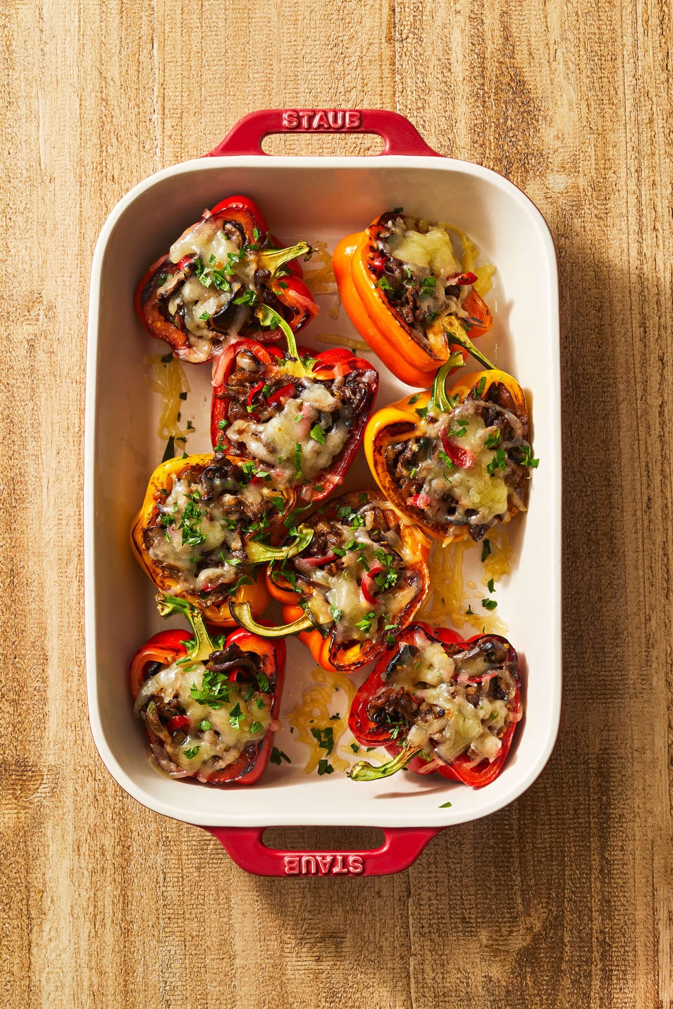 philly cheesesteak stuffed peppers in a baking dish