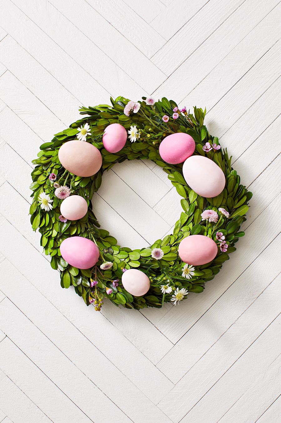 boxwood wreath with eggs and flowers easter craft