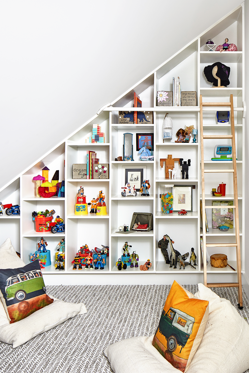 Attic converted into playroom with open display shelves attic converted into playroom with open display shelves