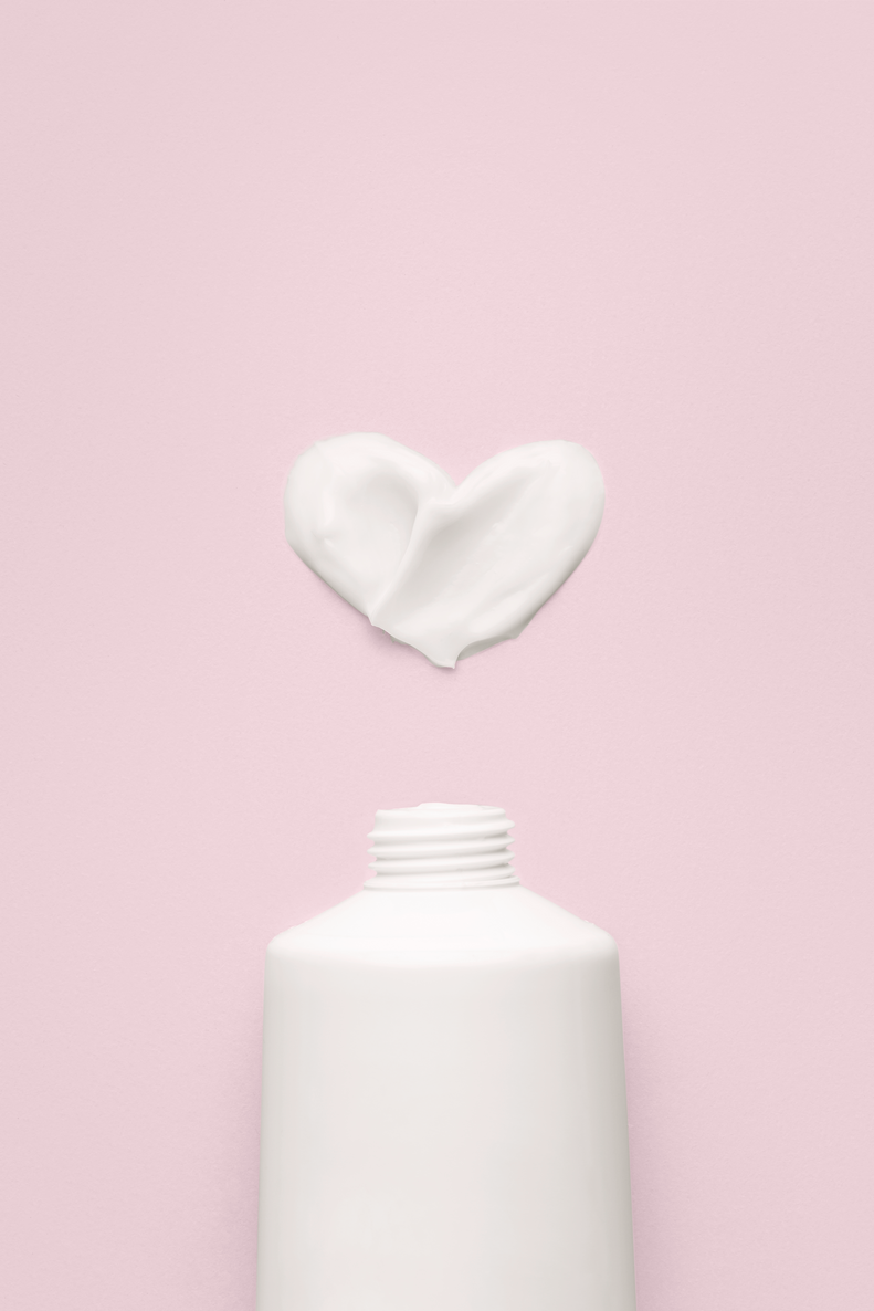 a white bottle with a white cap