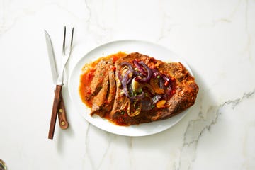 slow cooked brisket plated on marble counter top