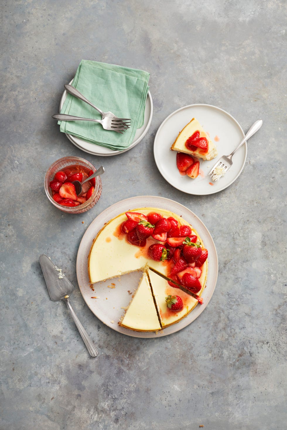 strawberry coconut crust cheesecake with glazed strawberries on top