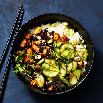 sticky tofu bowl rice with green scallions, cucumbers, and cilantro