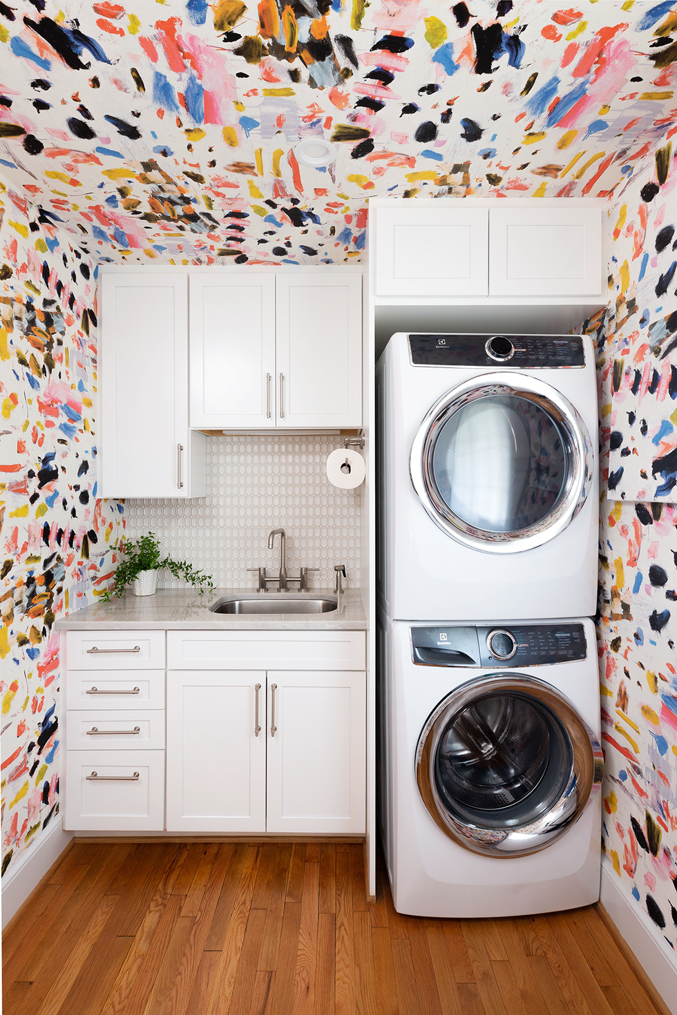 laundry room with pierre frey wallpaper by designer gray walker from gray walker interiors washer and dryer basements