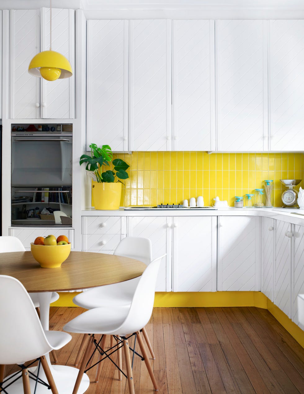 kitchen ideas white cabinets with yellow backsplash and floor board