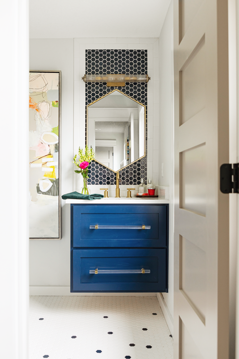 bold bathroom with blue cabinet