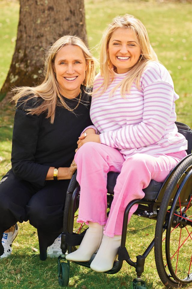 two women sitting in a wheelchair
