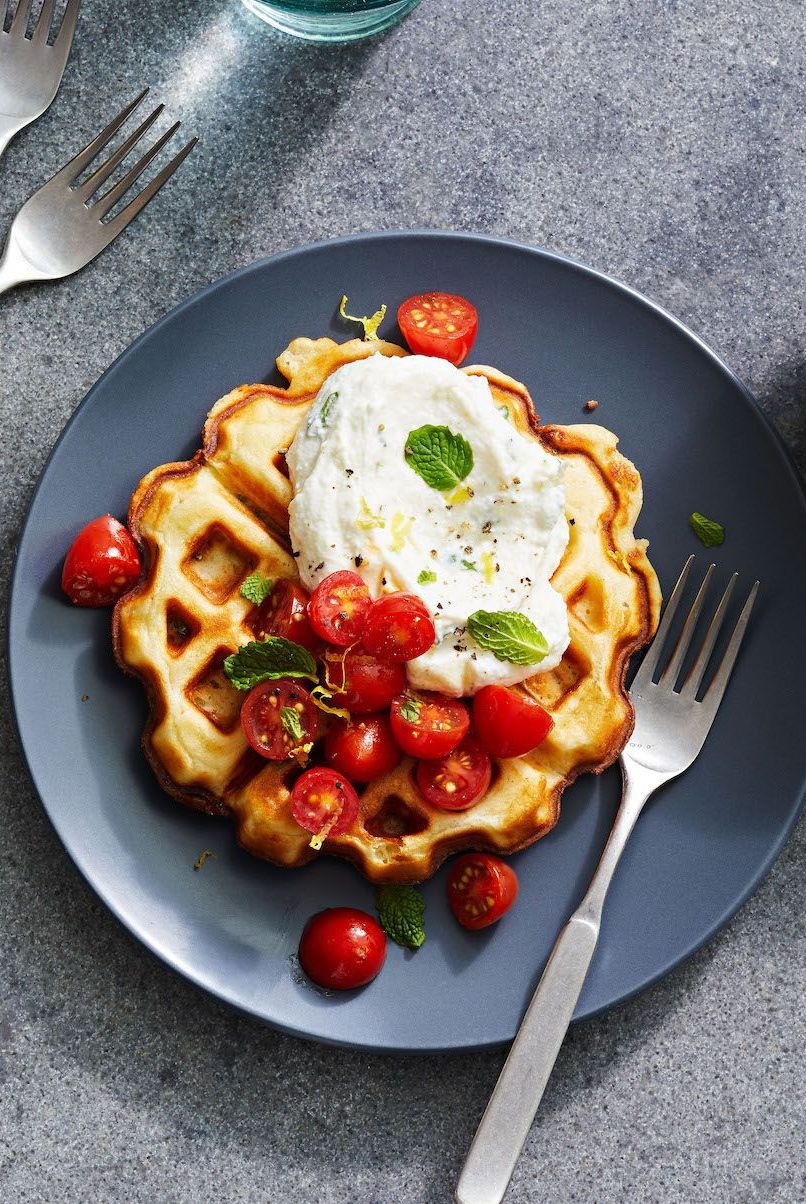 parmesan waffles with lemon ricotta and tomatoes on top