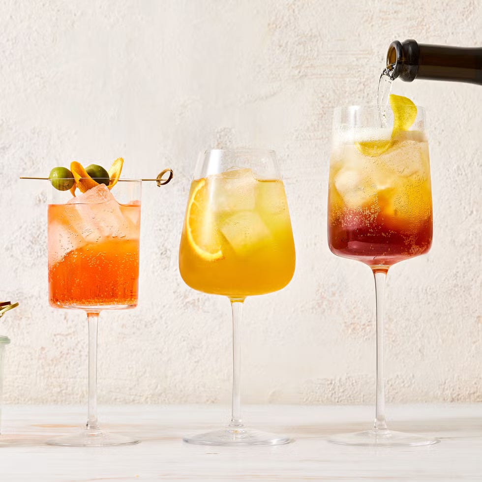 gran classico spritz cocktail with ice cubes and slices of lemon