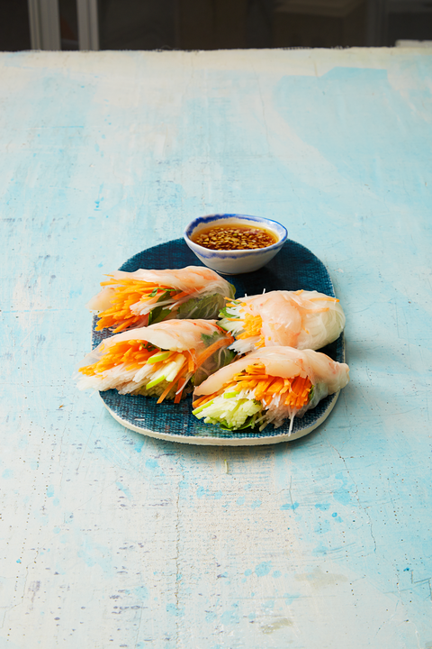 vietnamese shrimp and vegetable rolls on blue palte