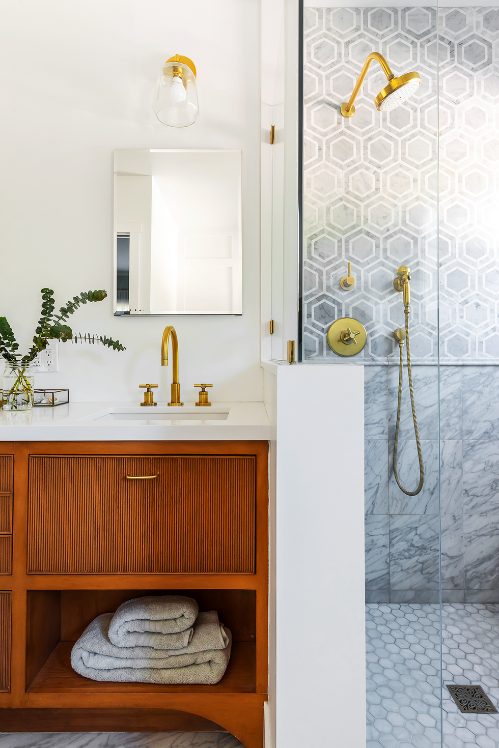 bathroom shower with gray and white marble tiles in multiple patterns folk victorian farmhouse home in pasadena, ca designers alice arterberry and barrett cooke of arterberry cooke architecture