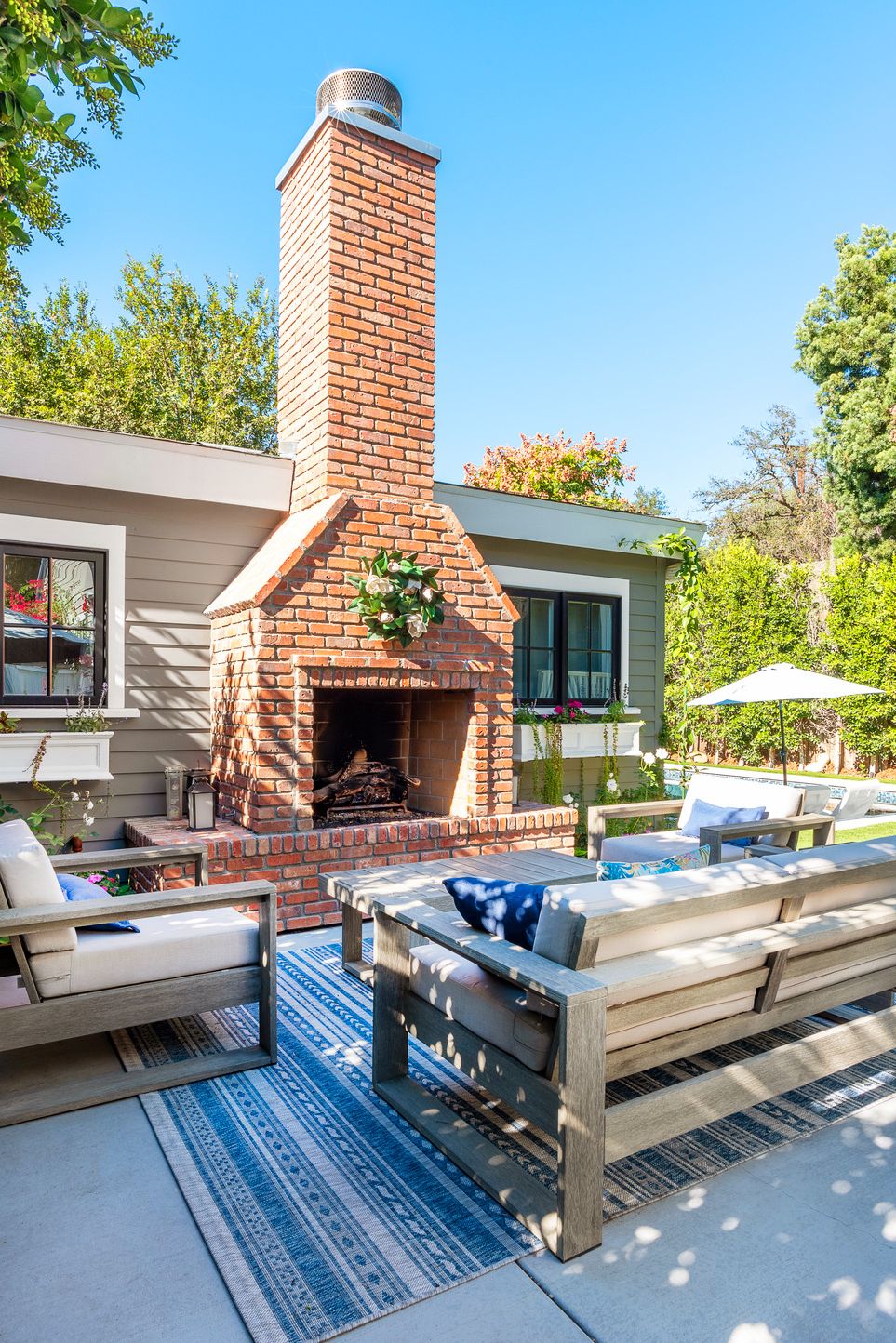 outdoor fireplace patio, englishpub bricks from general shale folk victorian farmhouse home in pasadena, ca designers alice arterberry and barrett cooke of arterberry cooke architecture