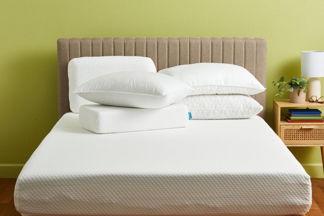 a bed with white pillows