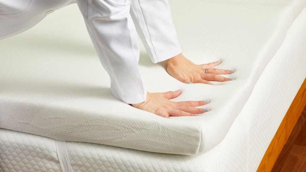 best memory foam mattress toppers - tempur-pedic adapt topper a gh analyst pressing into the foam of a mattress topper