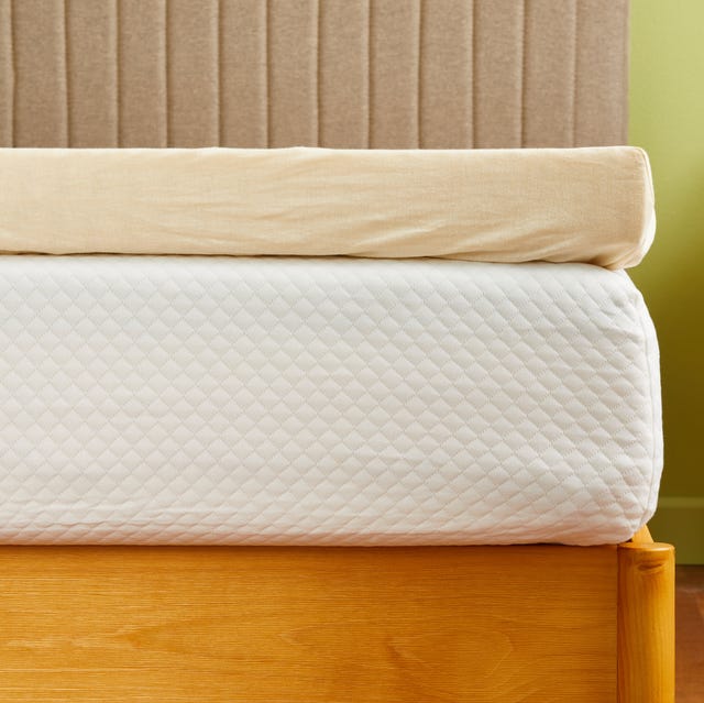 best organic mattress toppers - index a mattress topper with a beige cover on a white mattress