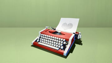 retro typewriter printing shape of heart with binary digits