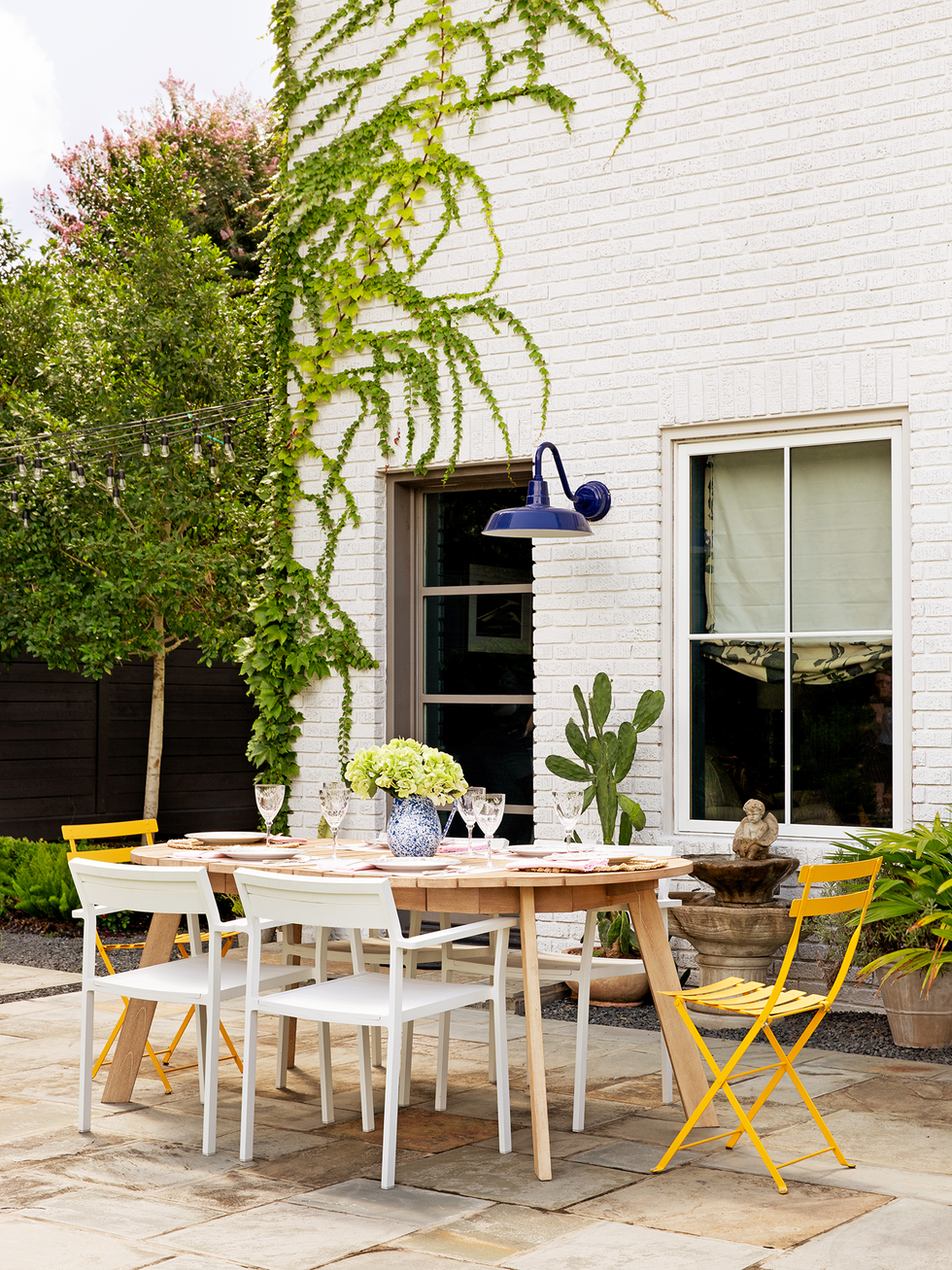 mix and match outdoor dining chairs around table