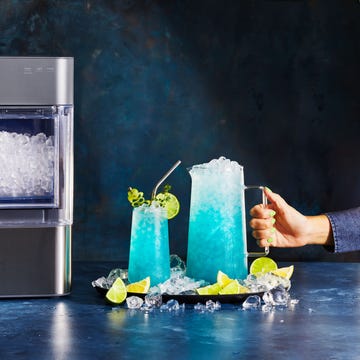 blue wave mocktails blue mocktails in a large pitcher and a tall glass